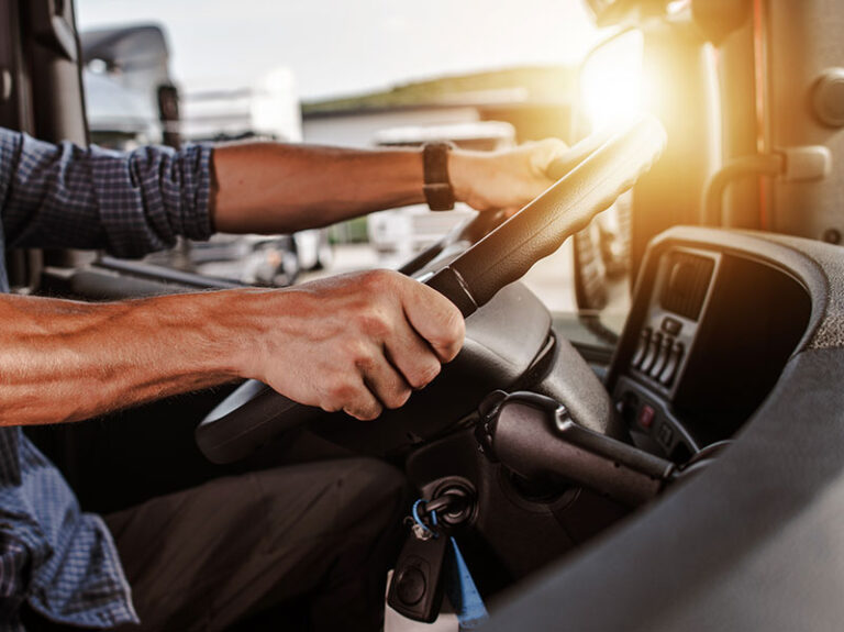 Photo of a semi-truck driver at work