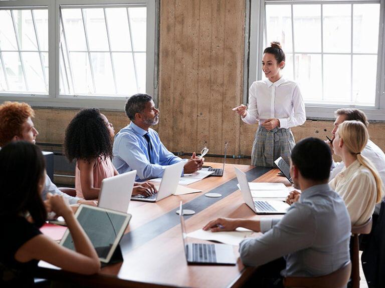 Female millennial manager directing her team