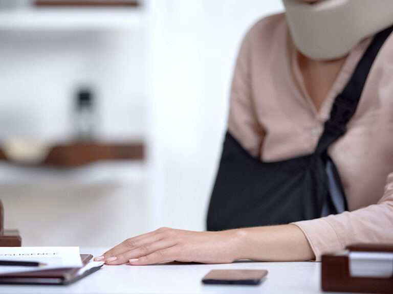 Worker with a broken arm and neckbrace