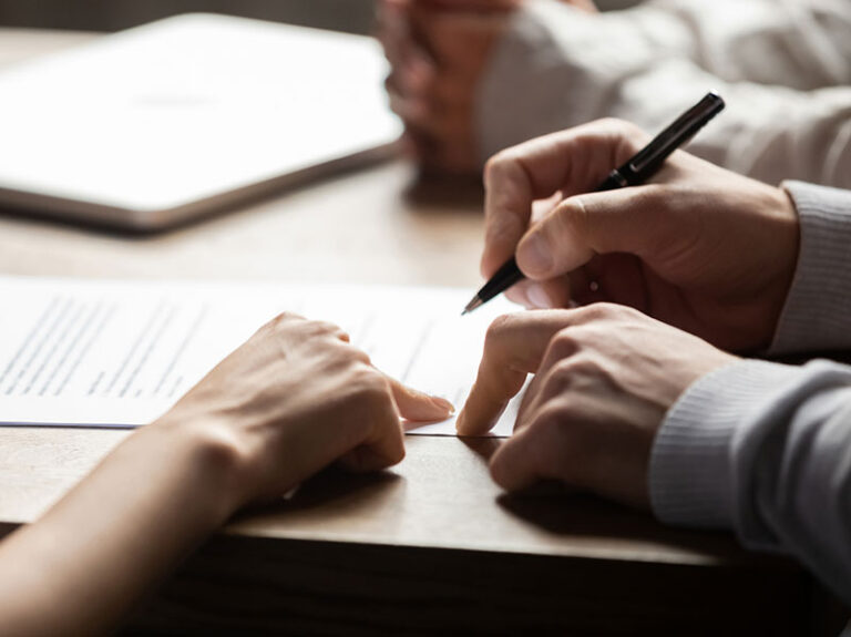 Group of people going through paperwork